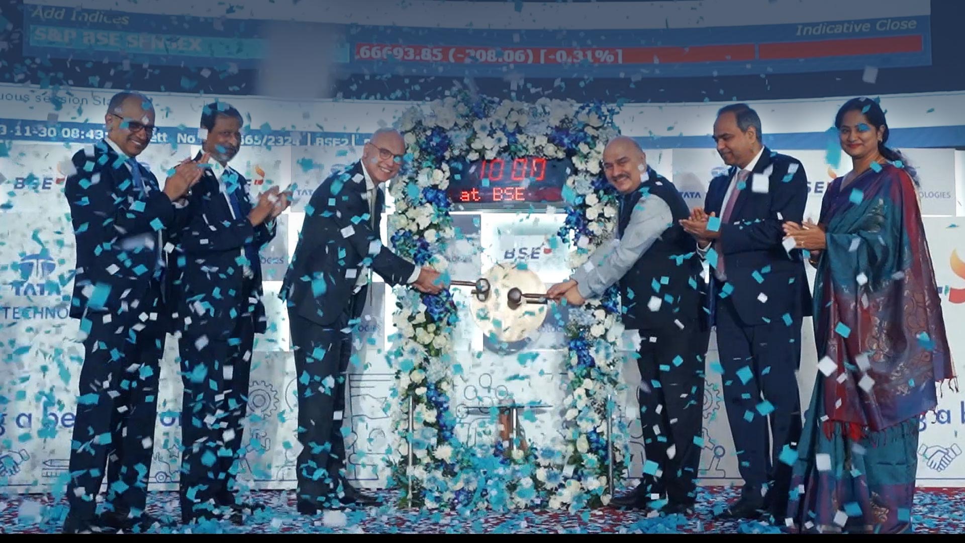 A video and picture depicting various employees and the stage setting for the Tata Technologies IPO