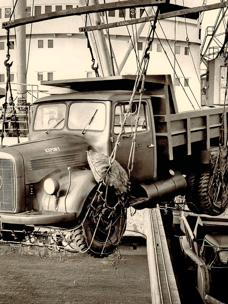 Truck being loaded on to ships